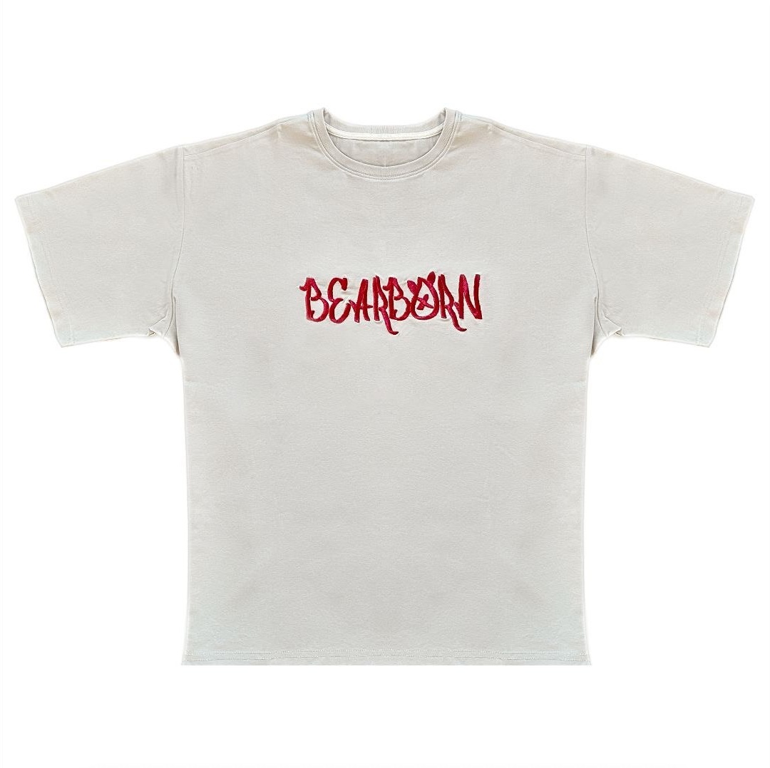 Drop 001 Tee in bone with a red embroidered Bearborn wordmark, flat front view